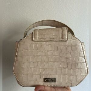 Carlos Santana cream bag